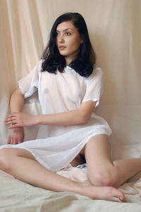 Tatar Captivates In Sheer Short Dress Striptease On White Bed With Bracelet And Earrings Indoors