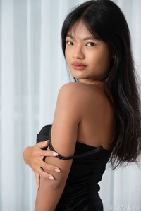 Lilly Narak Reclining On The Sofa Wearing Nothing But High Heels