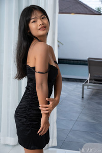 Lilly Narak Reclining On The Sofa Wearing Nothing But High Heels