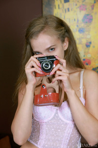 Xenia Glancing Back Over Her Shoulder With A Flirtatious Smile