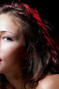 Nadya Poses Seductively In Black Stockings And Red Lighting Kneeling On A Chair