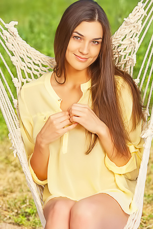 Adorable girl naked in her hammock
