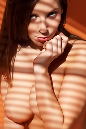 Sweetie takes off lingerie on camera.