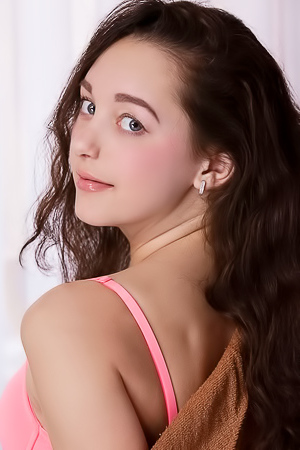 Solange Girl with pretty eyes and perky tits relaxes in her bed