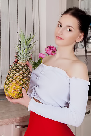 Busty Teen Posing In The Kitchen
