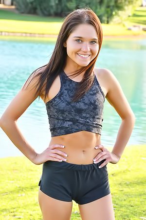 Zoe FTV Sporty Zoe FTV works out on a green lawn