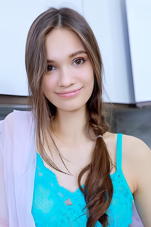 Anastasia Bella Tugs Her Panties Aside For A Glimpse Of Her Shaved Pussy