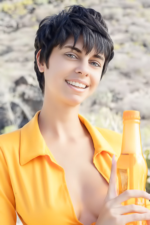 Kensi Dressed In A Bold Orange Crop Top That Hugs Her Perfect Breasts And A Matching Mini Skirt