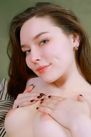 Carley Going Face Down On The Covers For An Enticing Rear View