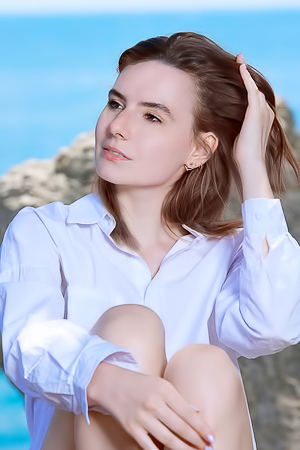 Nika Smiling With Pleasure As The Stimulating Ocean Breeze Caresses Her Sexy Body