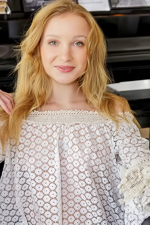 Dana Red With Strawberry-blonde Hair Lounging Naked In An Armchair