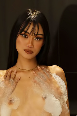 In the jacuzzi, Ryn playfully teases while enjoying an ice cream cone