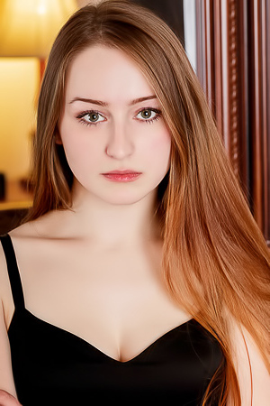 Evelin Her Soft Breasts Bare And Her Mesmerizing Blue Eyes Shining Seductively