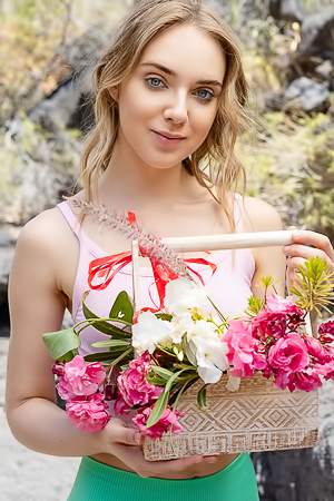 Oxana Chic Shows Off In Crop Top Gathering Flowers, Teasing View Under Shorts
