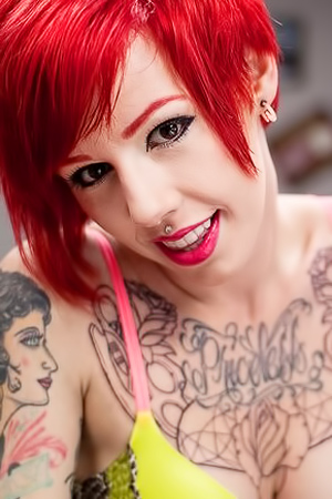Tierannys Tattooed Hands Commanding Power in Gothic Room