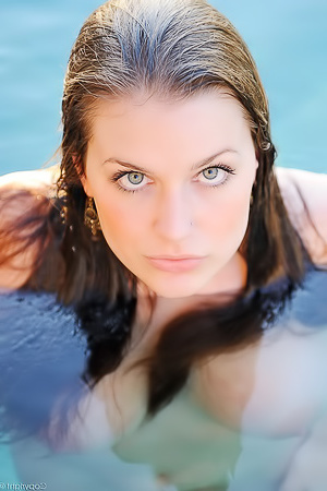 Beautiful body is getting wet in the pool